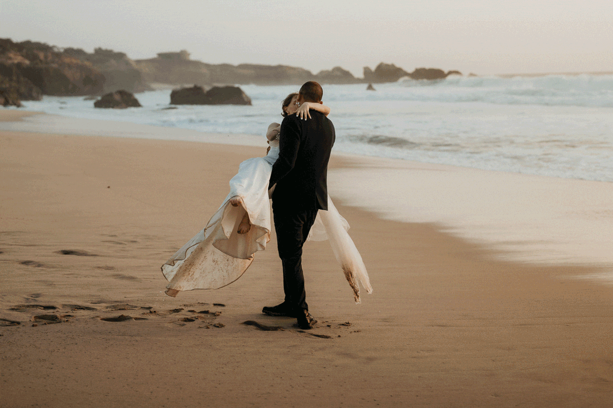 Bride and groom dance on the beach after their Big Sur elopement