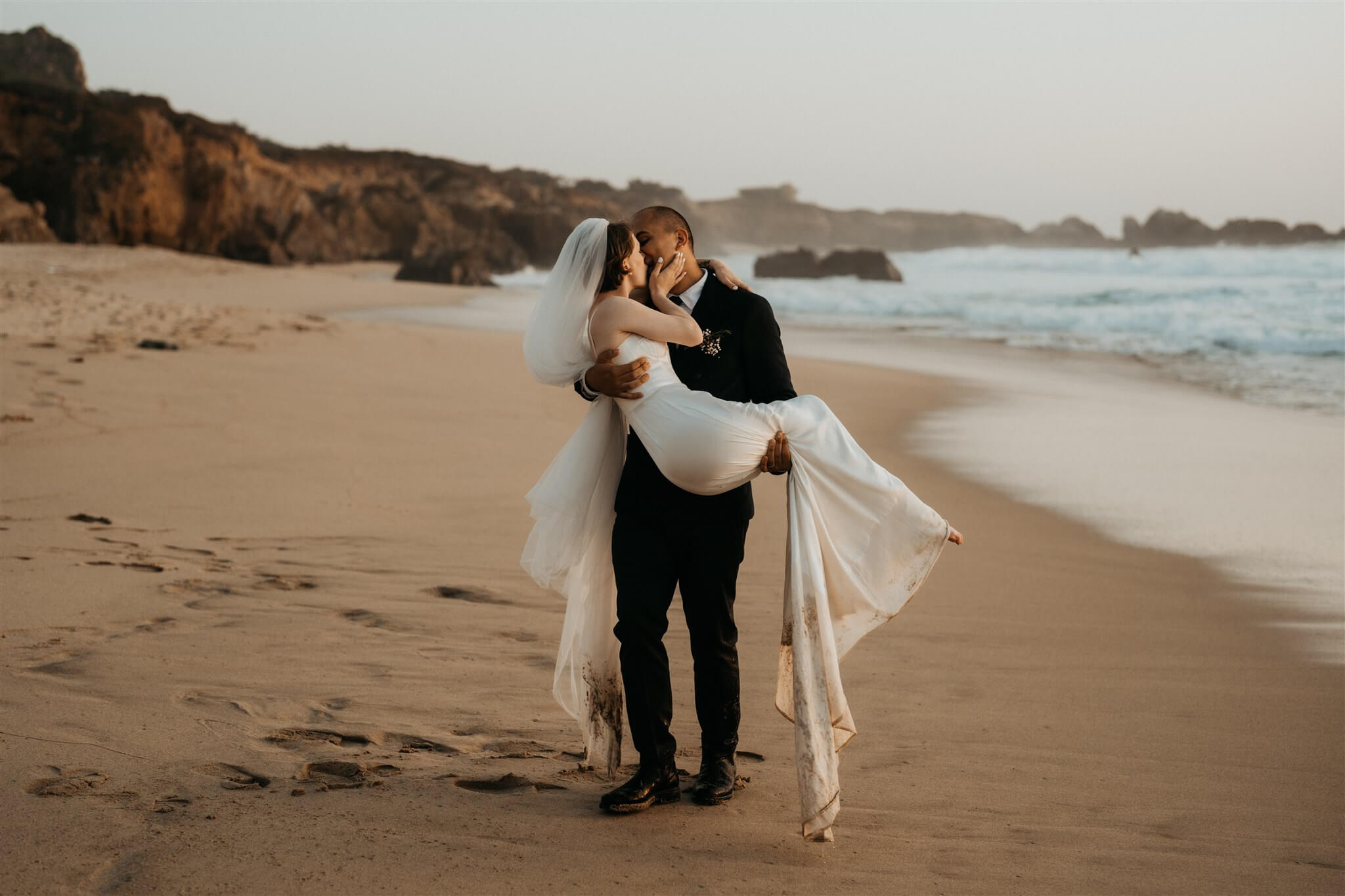 Bride and groom portraits on the beach at Big Sur