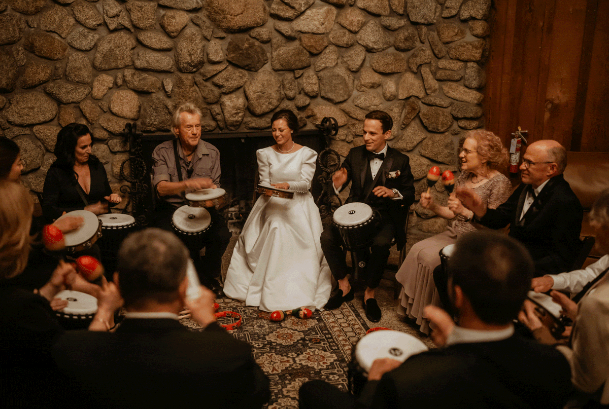 Bride and groom drum with guests at California micro wedding