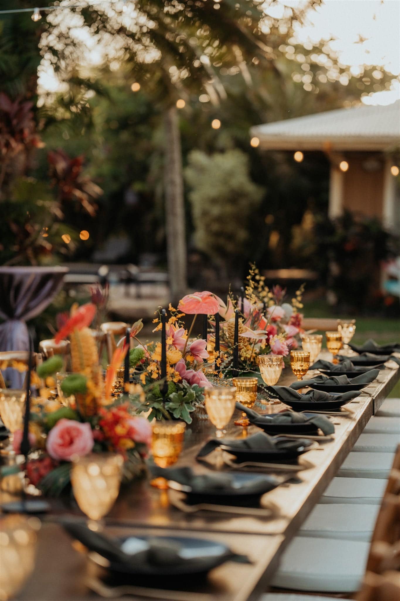 Flowers line an elopement reception table