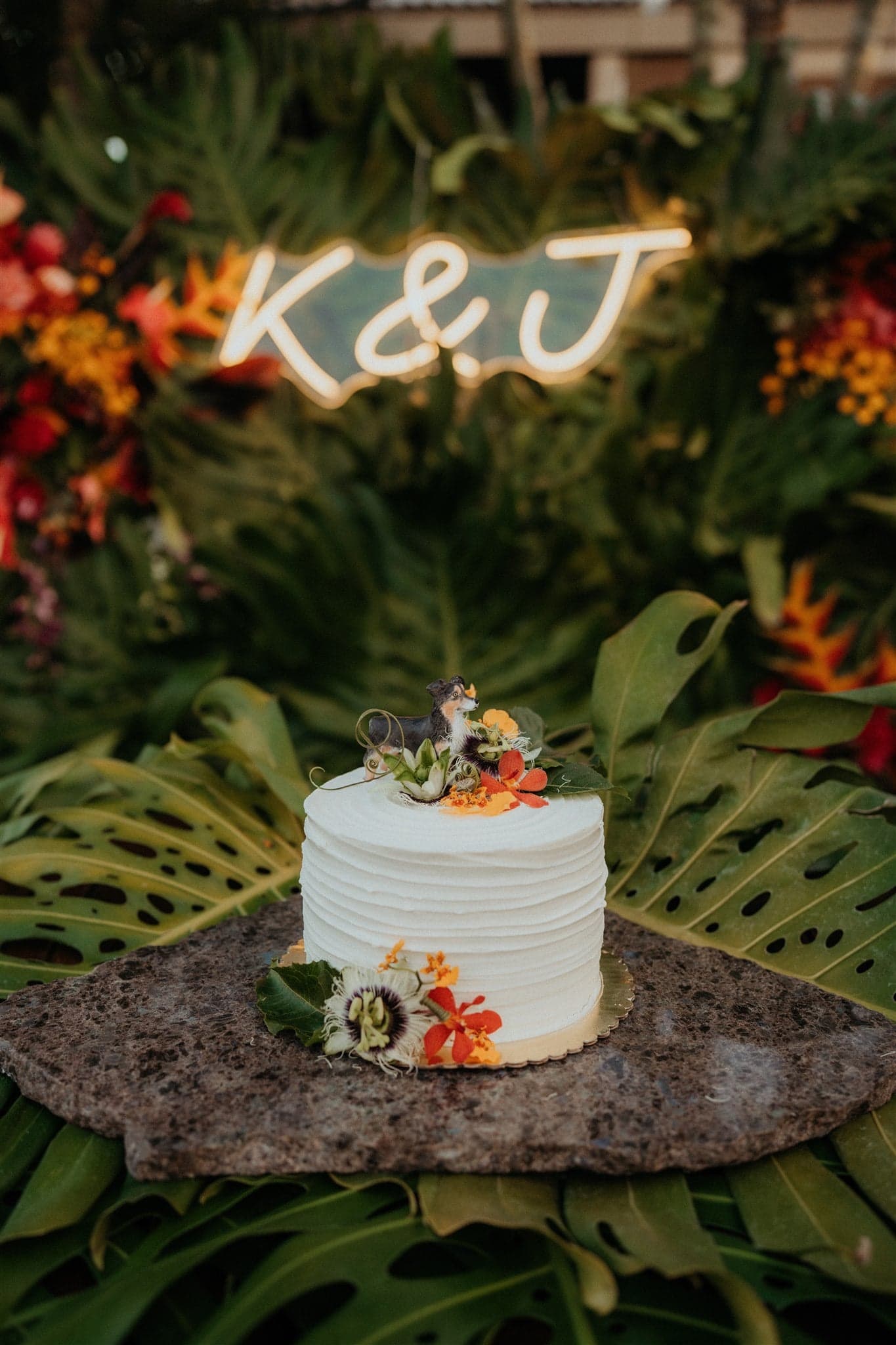 White wedding cake with orange and green flowers