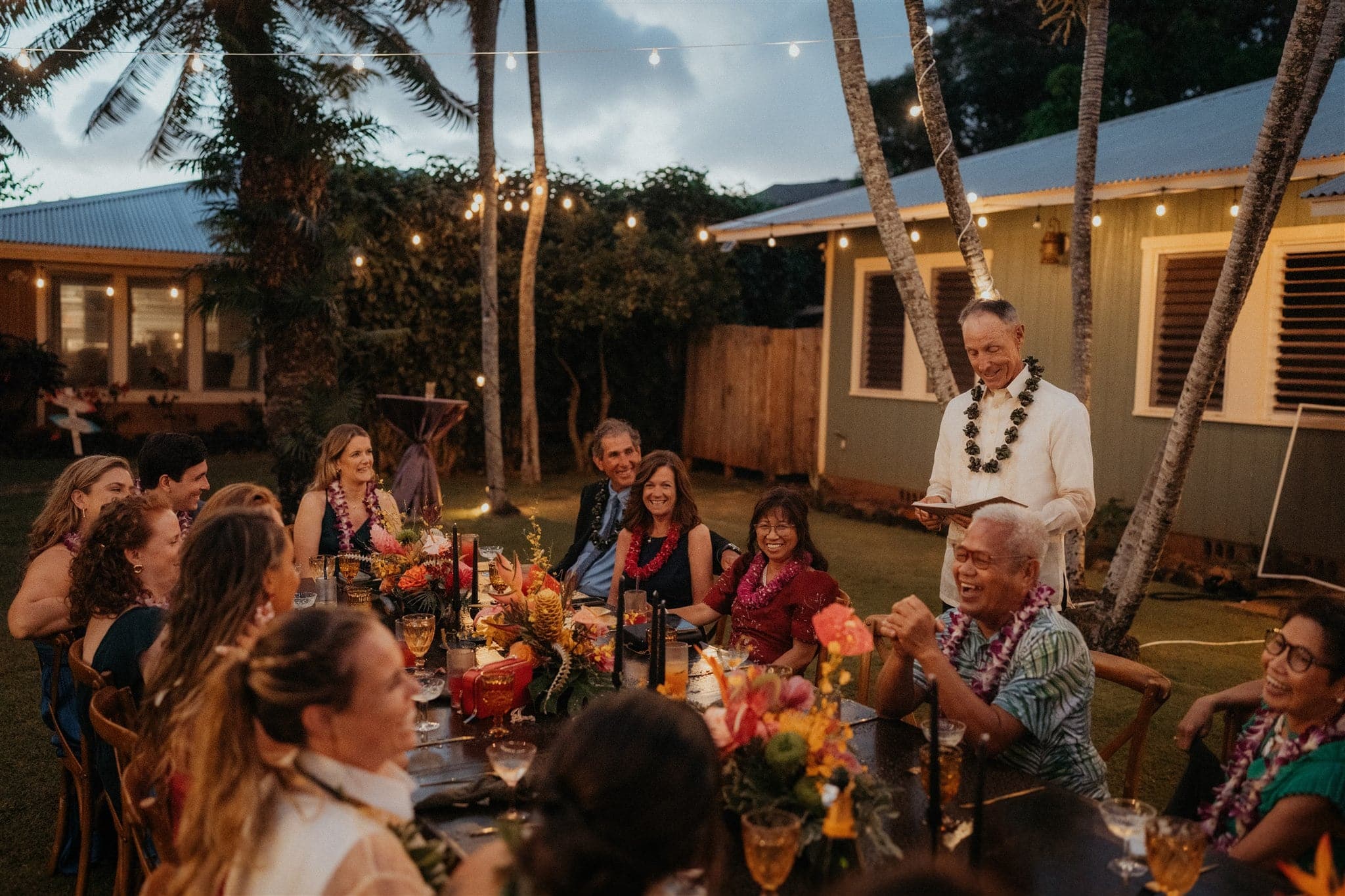Guests give speeches during an elopement reception in Hawaii