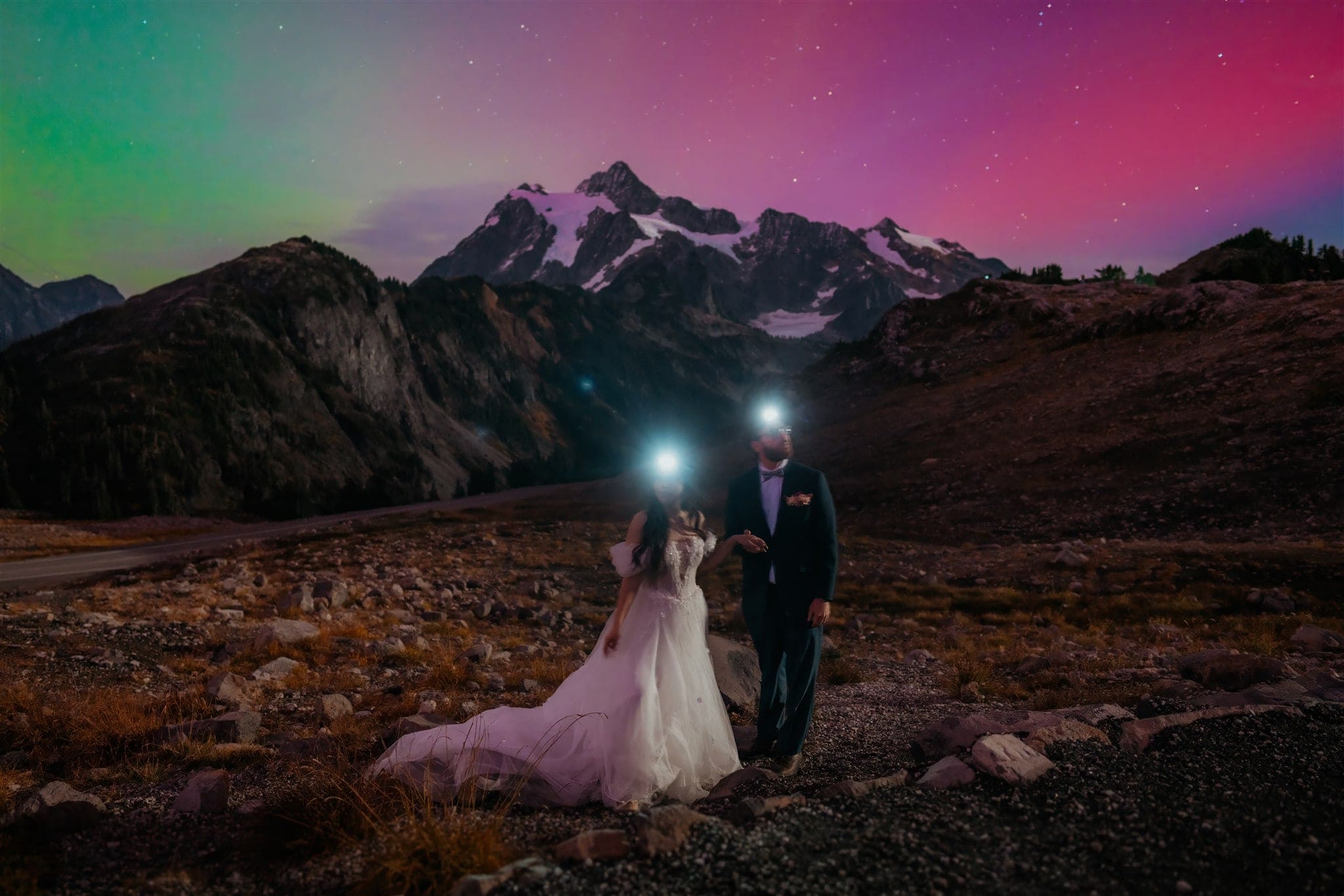 Bride and groom wear headlamps during their hiking elopement with the Aurora Borealis