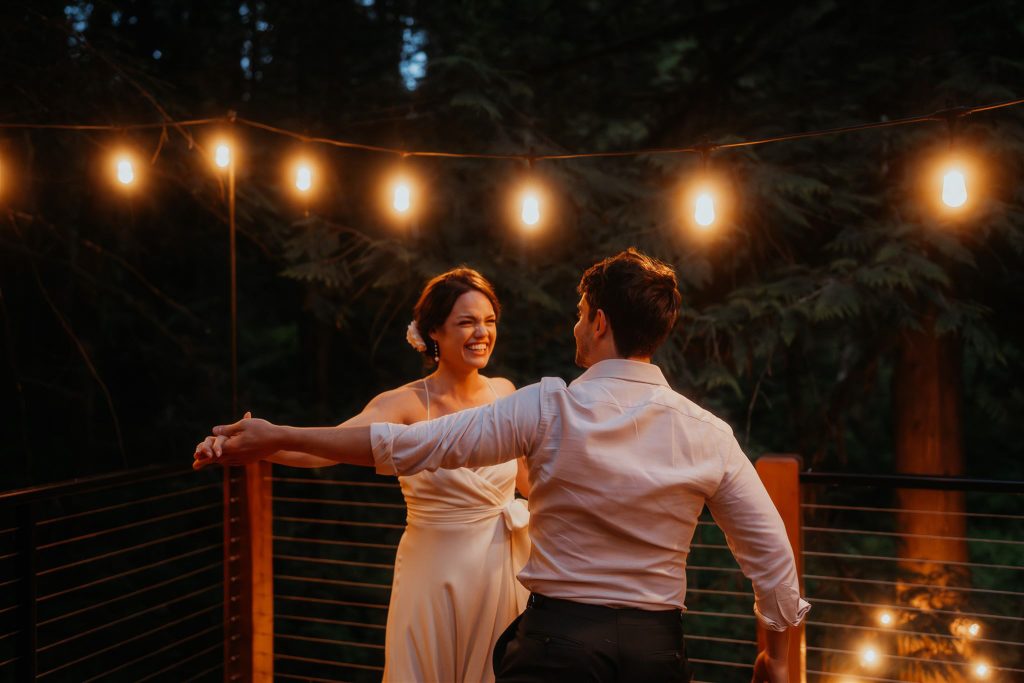 the newlyweds dancing on their deck during their Washington micro wedding.