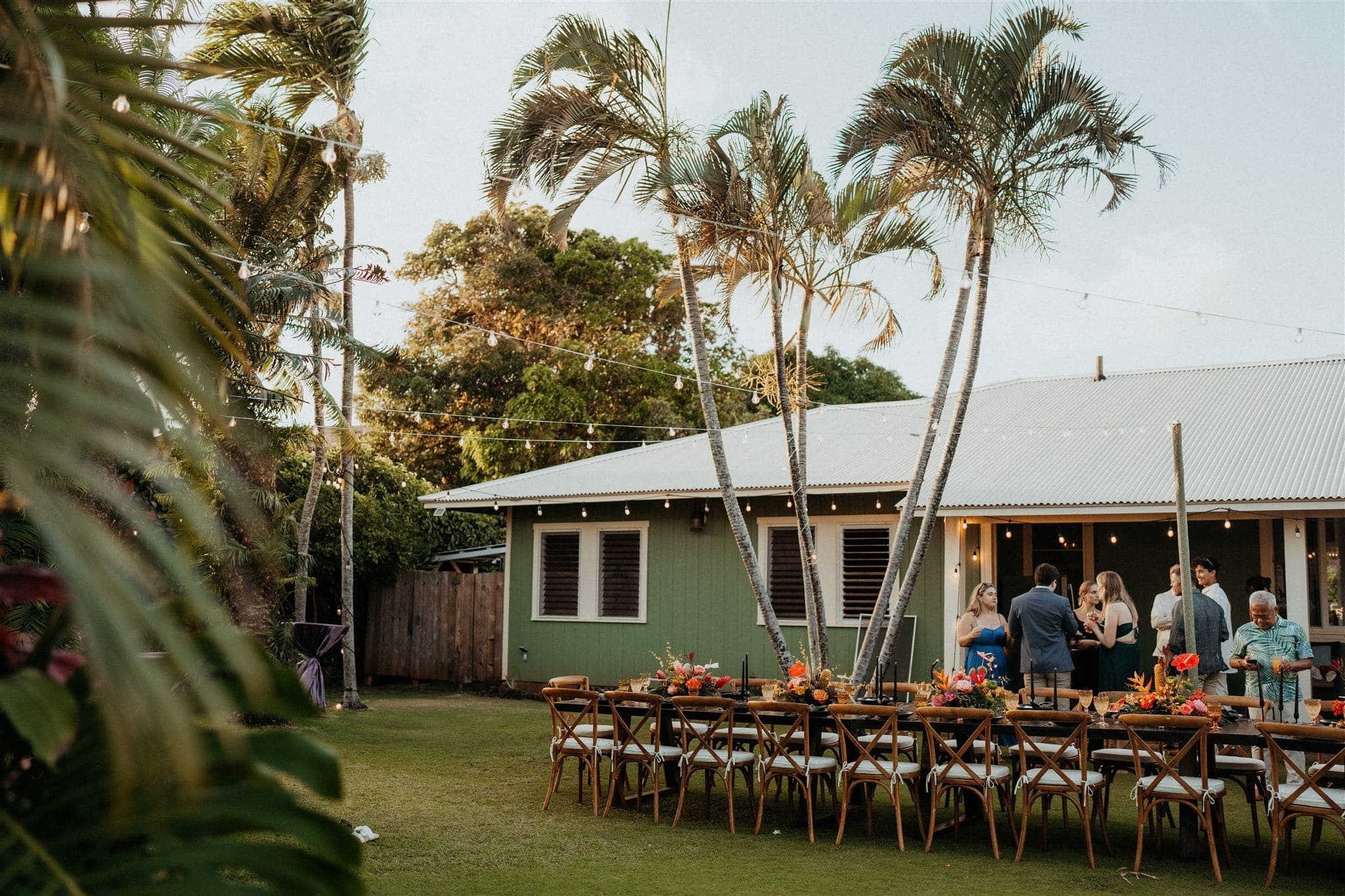 Kauai micro wedding reception dinner on the lawn of an Airbnb.