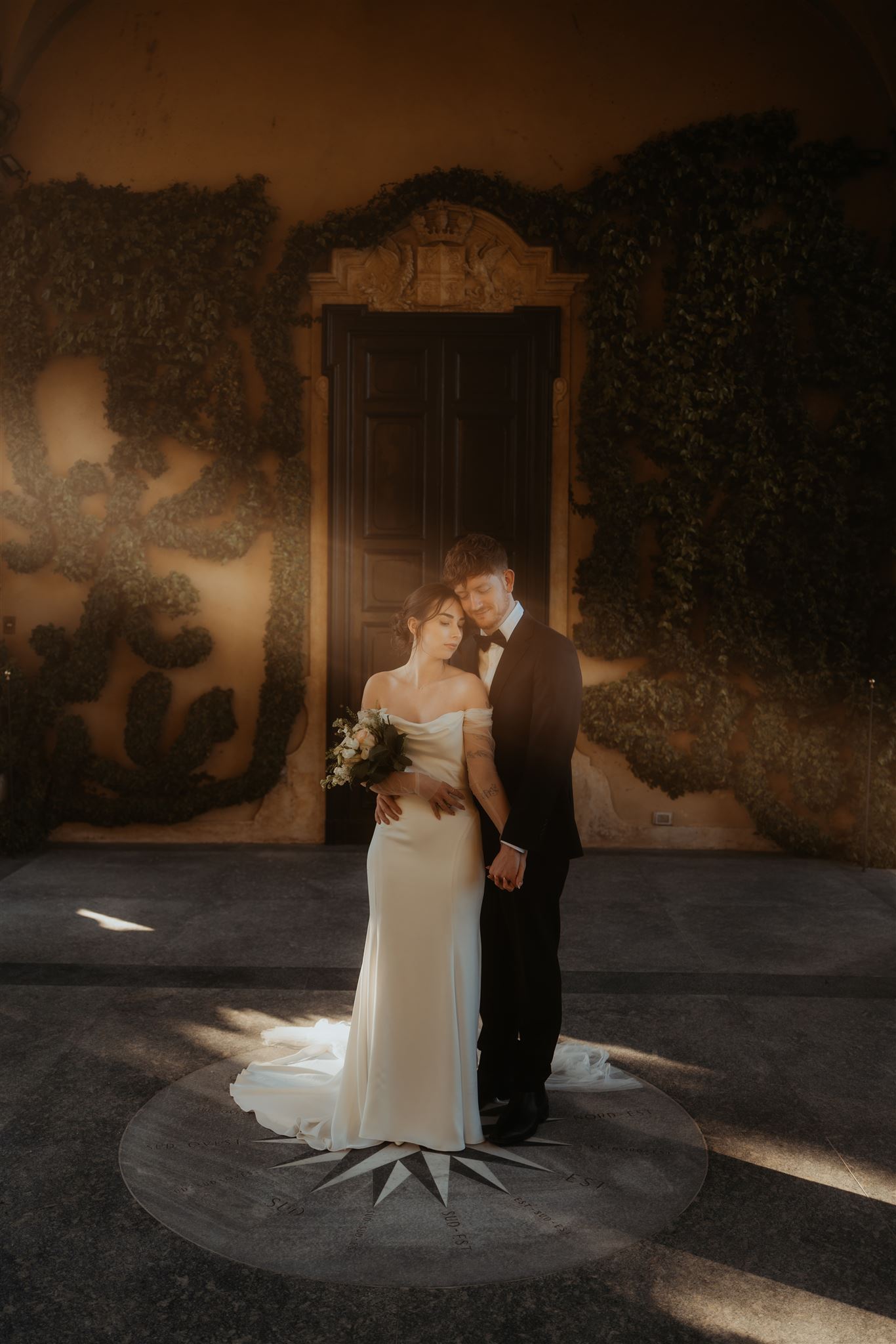 Bride and groom hug at a wedding villa in Italy during their multi day wedding celebration.