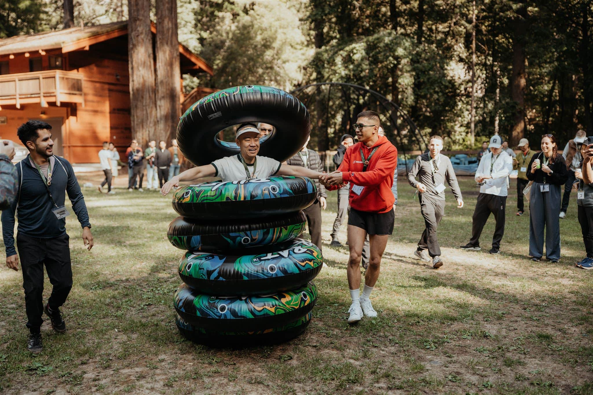 Guests enjoy summer camp games during a multi-day wedding in California.