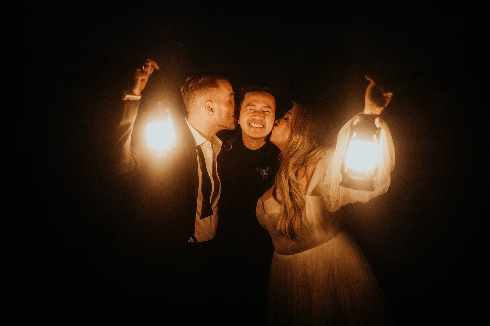 Bride and groom kiss their Brookings elopement photographer on the cheek at the end of their two-day micro wedding.