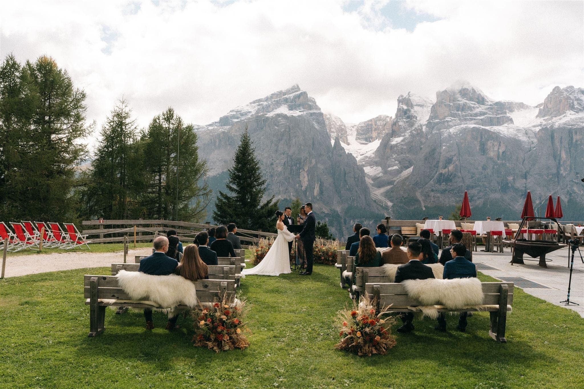 Outdoor wedding ceremony at Col Pradat, a mountain wedding venue in the Dolomites.
