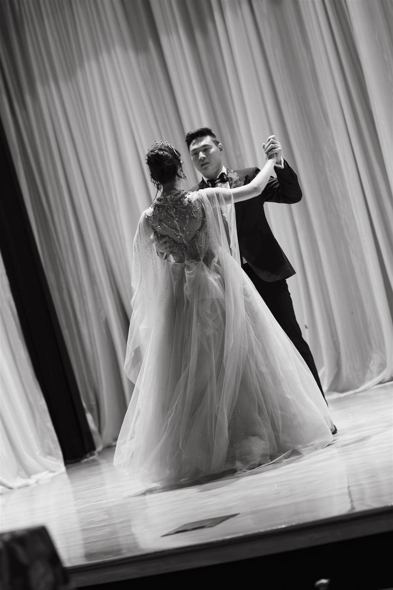 Bride and groom dance during their Chinese Garden wedding reception in Seattle.
