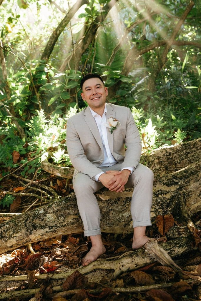 Groom portrait photos in a forest during a Kauai elopement.