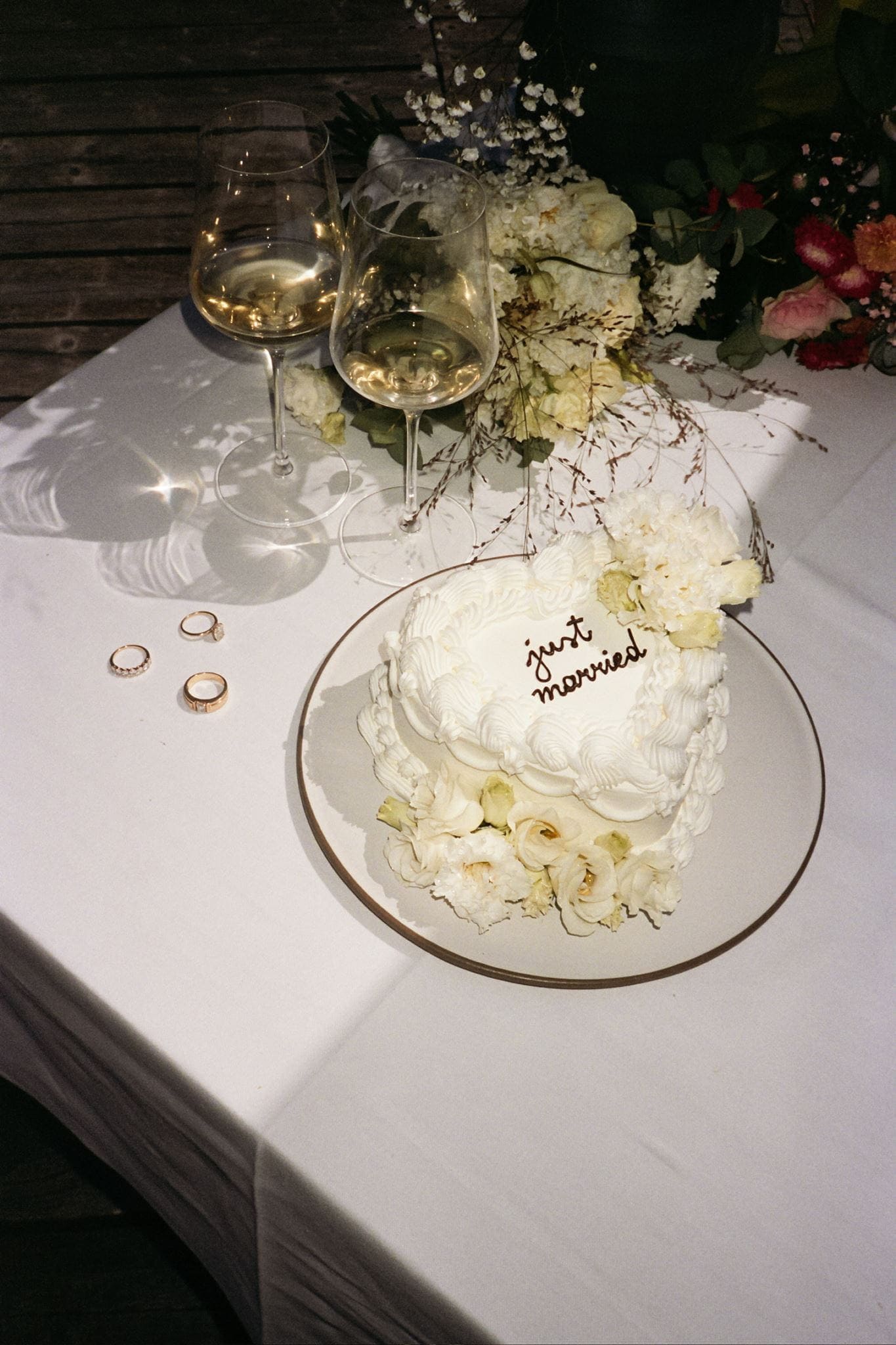 White heart wedding cake with "just married" black icing.