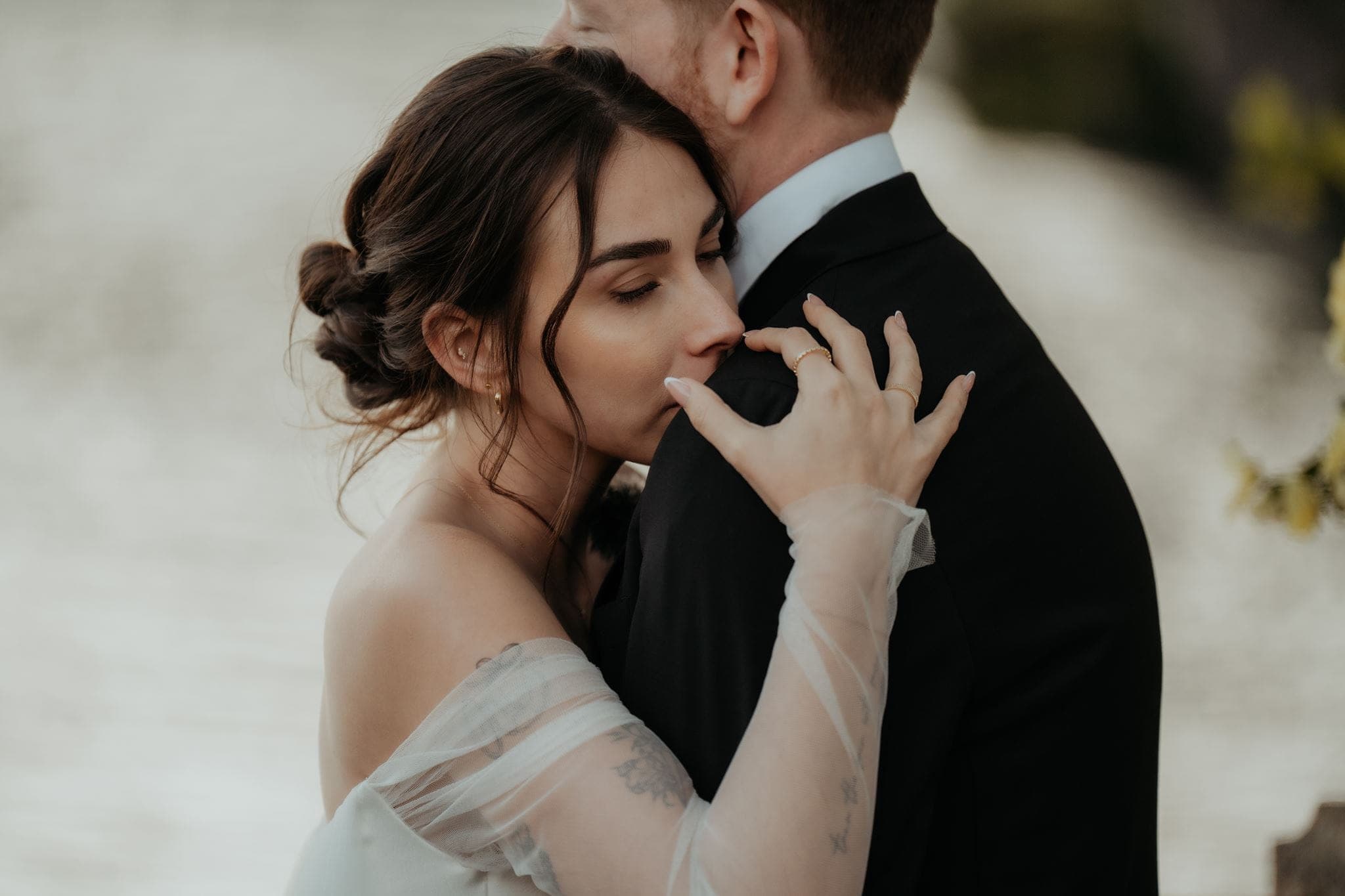 Newlyweds embrace after their elopement ceremony at Lake Como.
