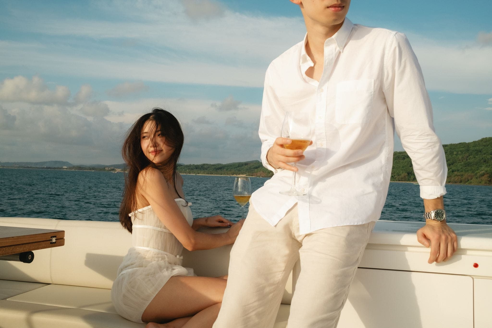 Couple lounges on a boat during their destination engagement in Vietnam.