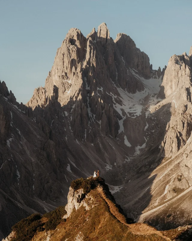 They woke up before the sun. Just the two of them. Wrapped in stillness, Holding hands beneath a sky that was still dreaming
Sharing vows as the morning light spilled across the Dolomites where alpenglow was dancing on windswept ridges

Just the two of them.
Saying words from their hearts that only they could hear.
No audience. No applause. Just the mountains holding witness

They preserved something just for them
a moment that even my camera could not fully capture.
A vow spoken once…but heard forever
between the two hearts that mattered most.

And then... they hiked down to meet their people.
The ones who raised them, grew with them, held space for them. Both their biological family and their chosen one. 
We found a lake so still it looked like glass for their ceremony
At sunset, we laid down blankets and stories.
A picnic with sandwiches, wine, homemade cake, and laughters between bites
I truly was an evening that was unhurried, unfiltered, unforgettable 

It was intimate, but not small. Personal, but still shared.

You can have both. The stillness and the celebration. The wildness of nature and the warmth of community. 
You don’t have to choose between eloping and including your loved ones. You just have to choose intentionally.

A and O, thanks for letting me be a part of your community even just for a day
I am grateful for you both and congratulations on your beautiful elopement

Photographed on @sonyalpha 
Edited with @hdpresets 

#dolomiteselopement #elopementwithguests #intimatewedding #adventureelopement #henrysdiary #sonya7iv