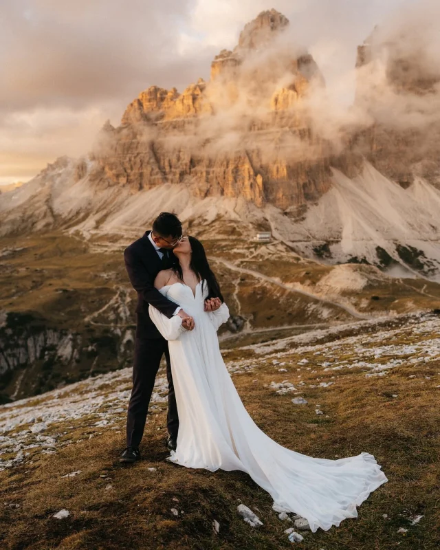 L and N brought their friends closest people to the Dolomites for their wedding to introduce everyone to the world of adventures they love

Like so many Asians with immigrant parents, L and N grew up in the world where Western and Eastern cultures are so intertwined that they didn’t want to forget their heritage. So they brought a bit of their Chinese culture to the Dolomites as well

In so many ways, their wedding feels like the kind of celebration my heart has been quietly longing for: a chance to honor the wild beauty Mother Earth offers us, and a chance to come home to the Asian culture that raised me, held me, and continues to shape the way I tell stories.

In a way, it’s like the world outside and the world within finally speak the same language

Thank you L and N for bringing me here to celebrate your love
Your 2-day wedding in the Dolomites truly was so intentional and so full of love. 

I love the way you two smiled till your faces ached. It was those real, unfiltered smiles that only happen when you’re surrounded by your favorite people in a place that feels like magic.

I love how your dad wandered over to the “vendor table” just to check on us to make sure we were fed, warm, and cared for.

I love how your friends all stayed in the same chalet with you so they could be there for you at any moment. No distance, no hesitation, just love wrapped in laughter and in between naps :)

And finally, I love how your mom hiked the whole way with us on the adventure day so she could take care of her children and keep them warm during sunset photos

Congratulations again and I am so so so grateful

———
A mixture of digital an film 🎞️ 
Digital on @sonyalpha
Edited with @hdpresets
 
Photography: @henrysdiary
Planner: @dolomitesweddingplanner
Videography: @tunguyenwedding 
HMUA: @viki_hairandmakeup
Catering: @hotelkolfuschgerhof.dolomites 
Venue: @colpradatrifugio and @chaletroenn